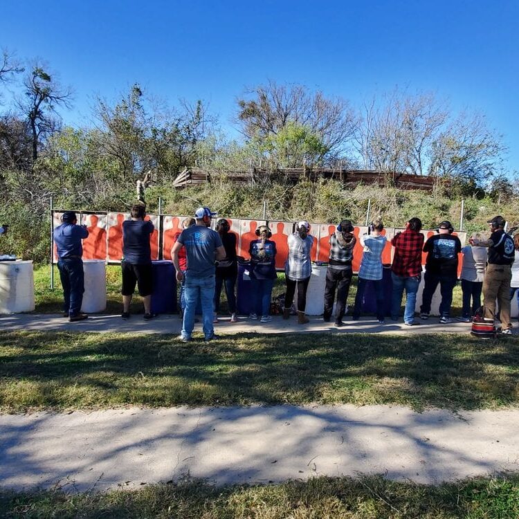 People participating in handgun license training in Waco under the supervision of an instructor.